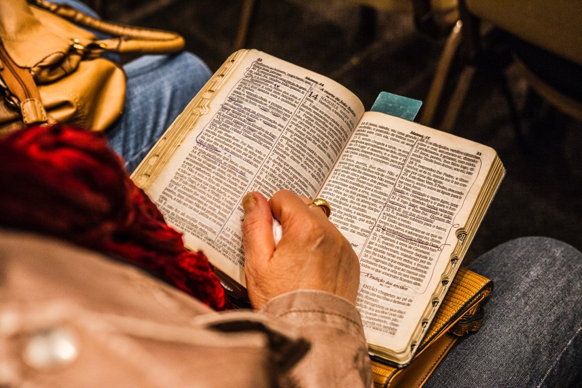pexels photo holding Bible scaled