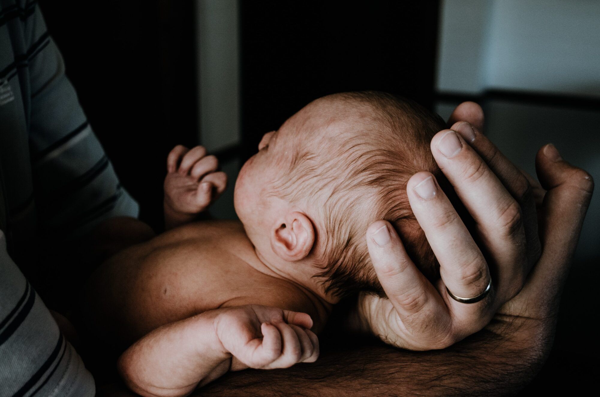 kelly sikkema father holding baby unsplash scaled