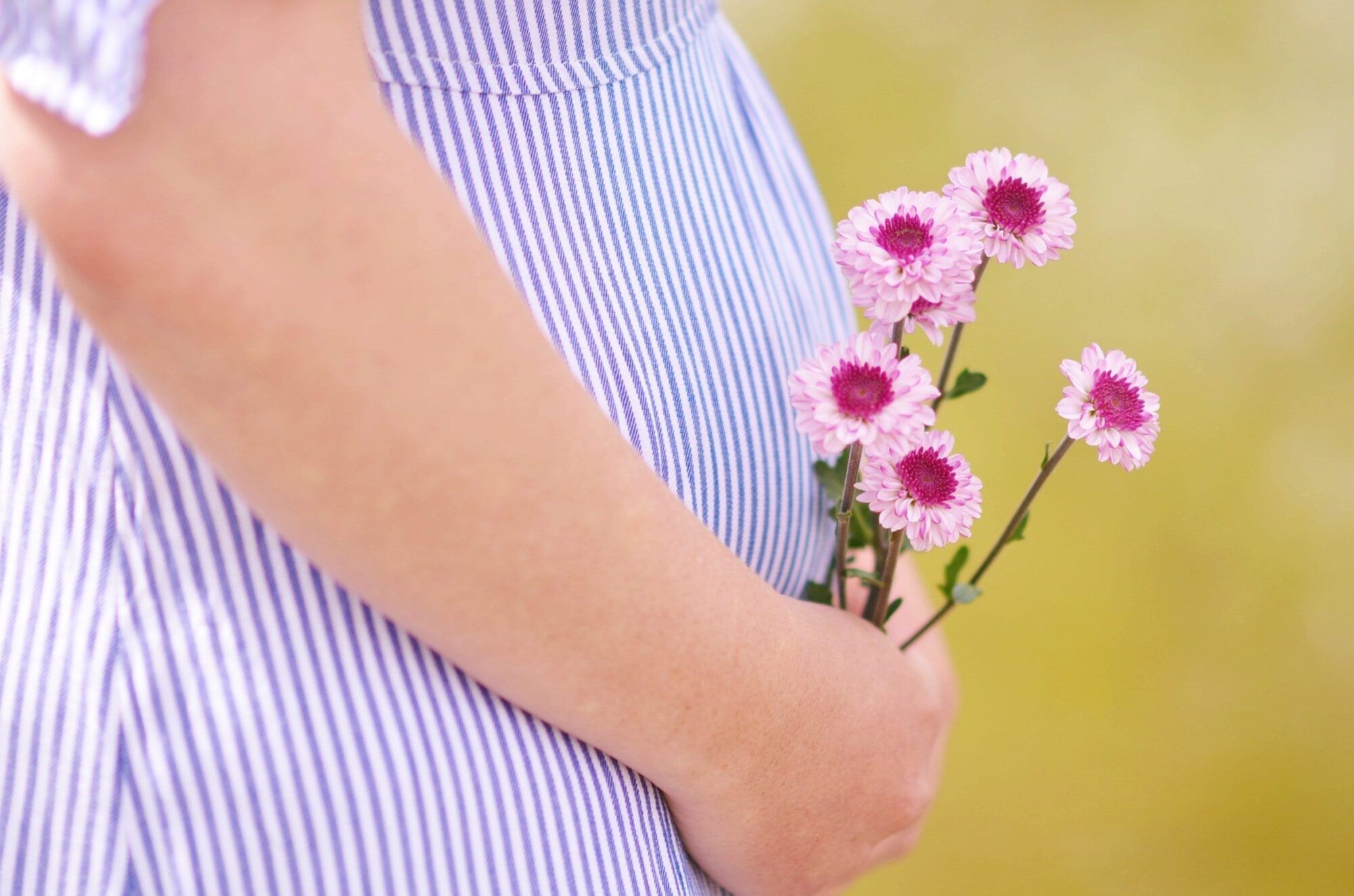 ashton mullins pregnancy flowers unsplash scaled