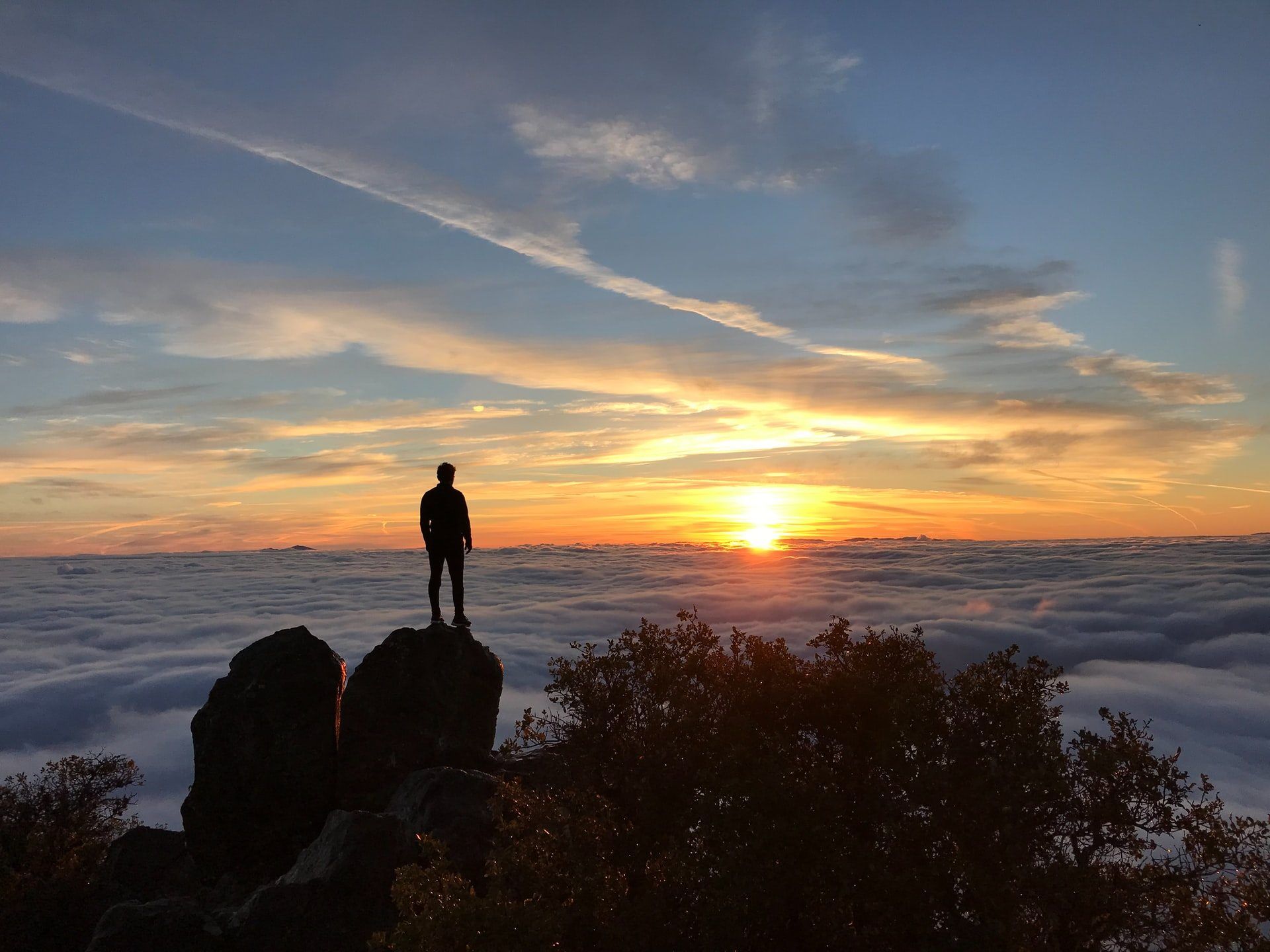 andrew man sun clouds unsplash
