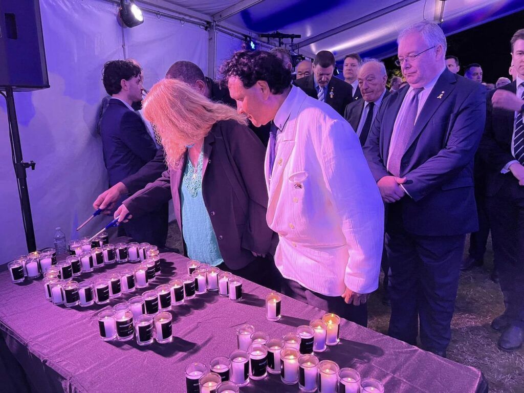 Barbara lighting candle Oct 7 Canberra Embassy
