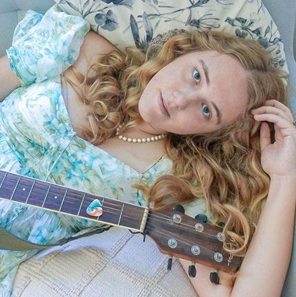 Amity Gilmour and guitar