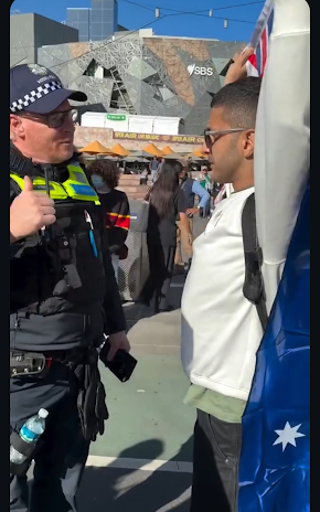 Iranian democracy advocate Arya had to be detained for his safety for waving an Australian flag outside a pro-Palestine rally at Flinders St on February 14. Picture: Facebook.
