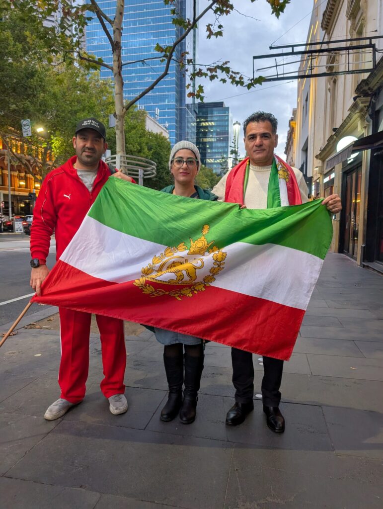 Azadeh Doosti (centre), pictured with Kevin Beykpoui and Mahmoud Doosti, said she was "angry" that Australian citizens have to pay taxes so the ISIS brides can be monitored, after they arrived in the country earlier this month. Picture: Josh Spasaro.