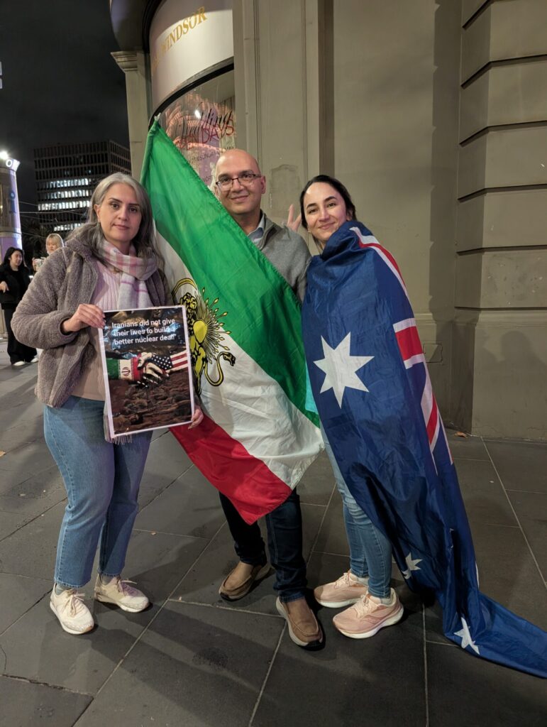 Regular Mel-Iran rally attendee, Mahdi Adhari, said it was hypocritical of the Albanese Government to let in the group of women and children with ISIS links at a time when democratic-seeking citizens of Iran were currently being denied entry visas. Pictured with Adhari are Sami Sepasi and Lili Jan. Picture: Josh Spasaro.