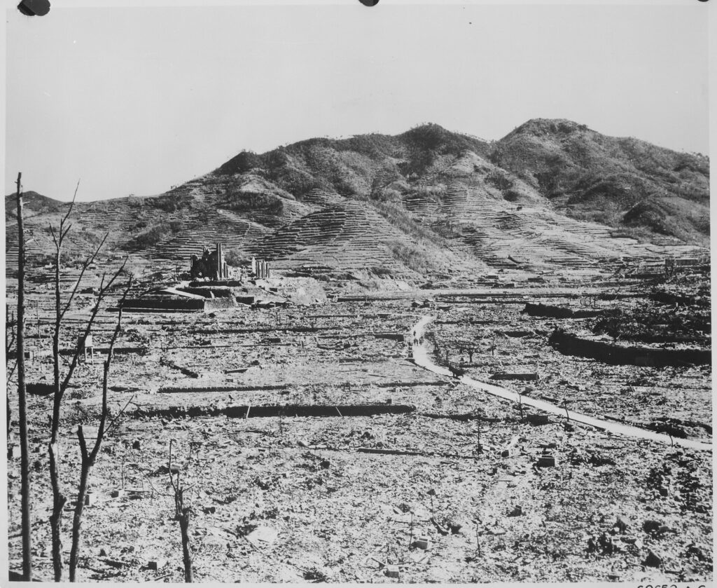 In the background, a Roman Catholic cathedral on a hill in Nagasaki, ca. 1945.